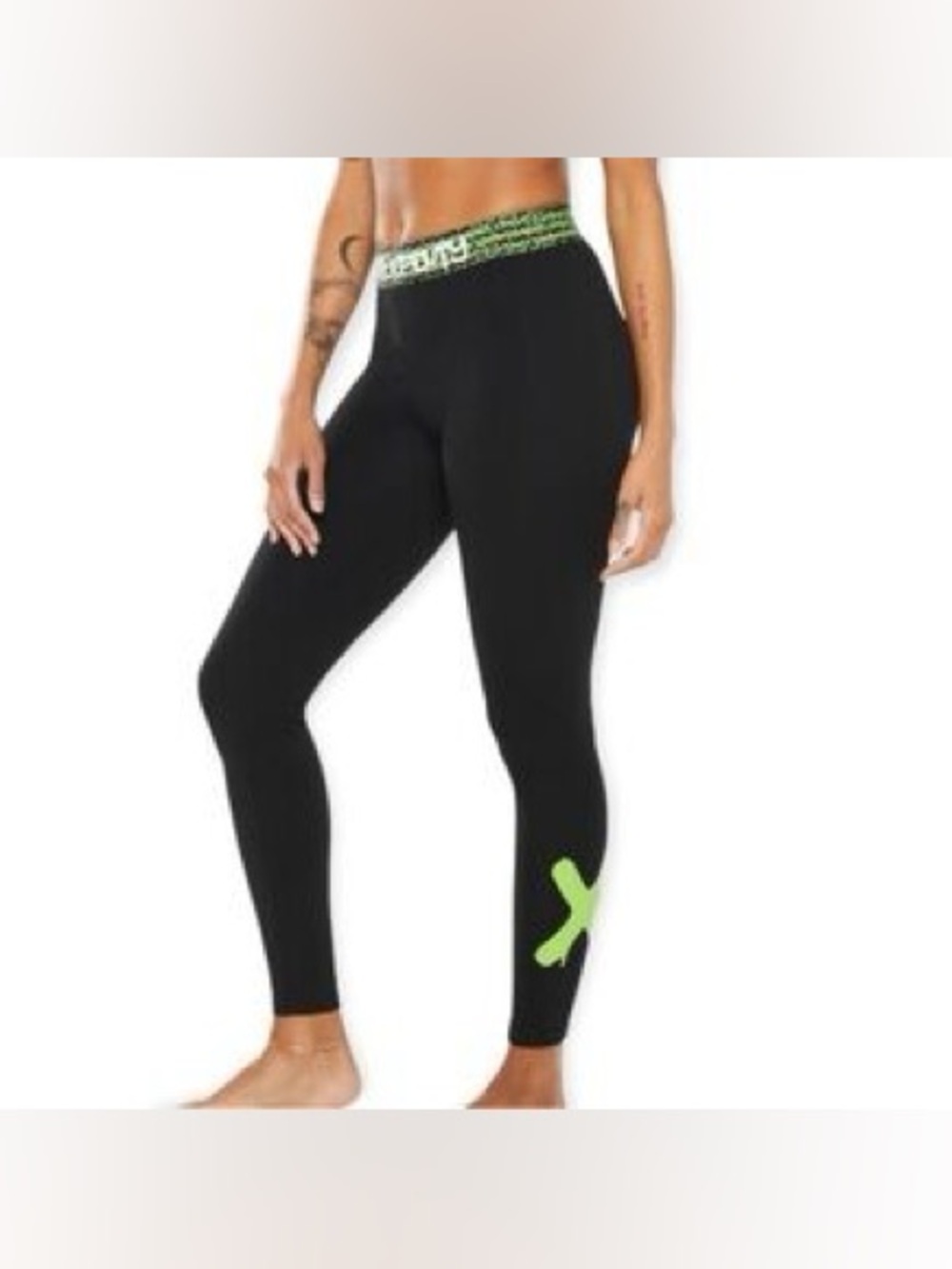 Savage X Fenty black & green leggings featuring a striking neon green "X" detail
